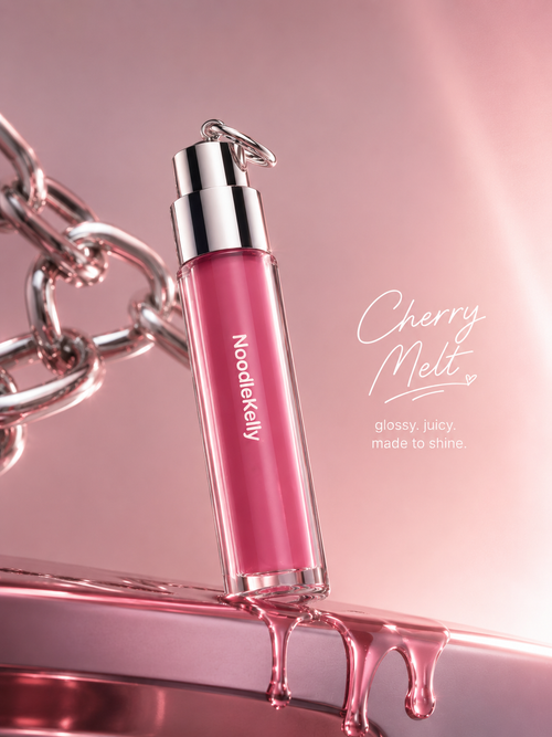 Pink lip gloss bottle with silver cap on a pink background, featuring the brand 'NoodleKelly'.